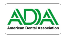 Green and white logo of the American Dental Association (ADA).