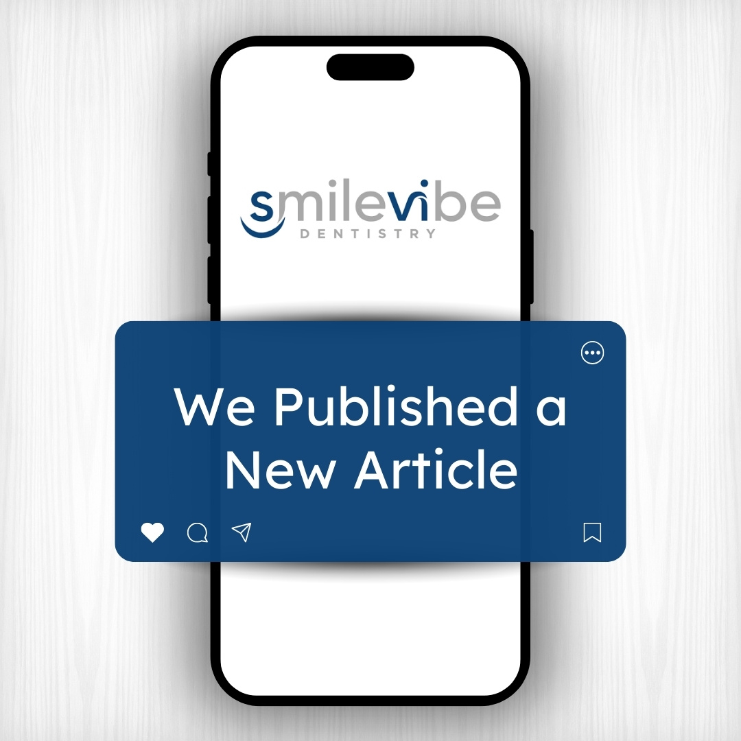 A smartphone displaying the SmileVibe Dentistry logo and a notification that reads "We Published a New Article.
